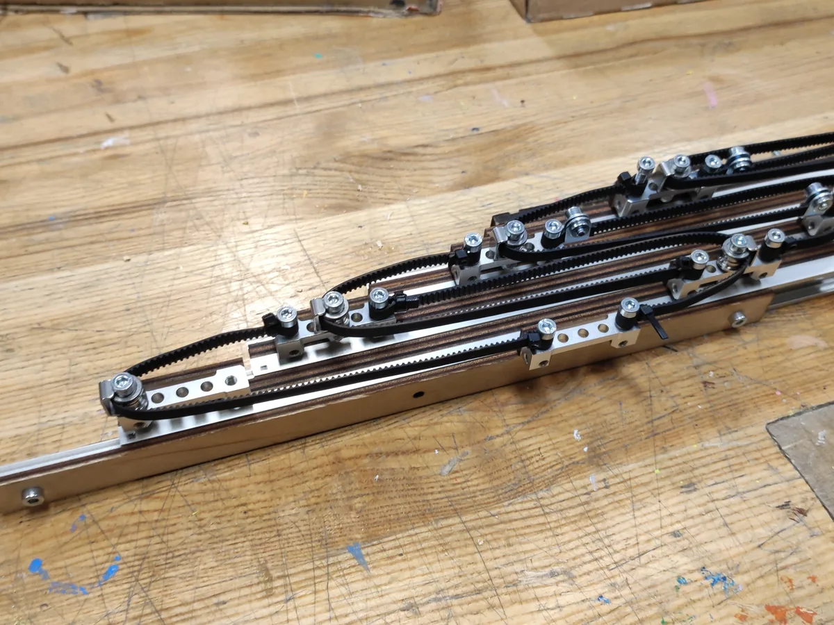 Cascading belt-driven linear lift, four stages, partially extended